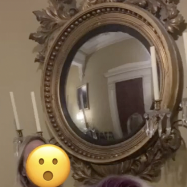 headless figure in mirror